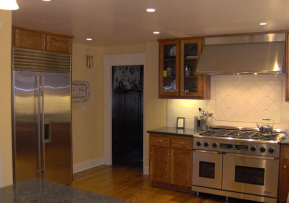 Cozy kitchen with modern features by Maurer Construction