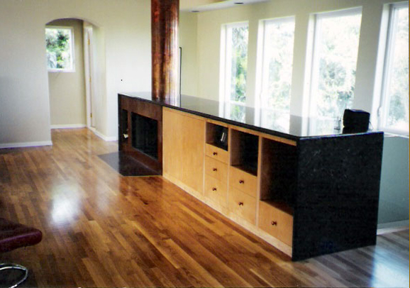 Sleek living room with updated fixtures by Maurer Construction